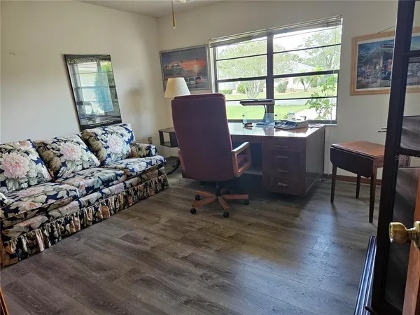 a living room with furniture and a window