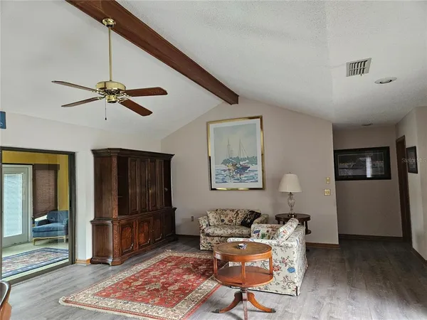 a living room with furniture and a rug