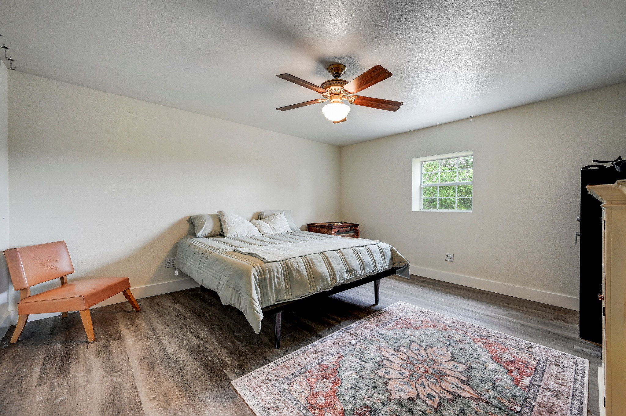 6350 Mt Sharp Road, Unit B Wimberley, TX 78676 - Photo 23 of 34 a bedroom with a bed and a window