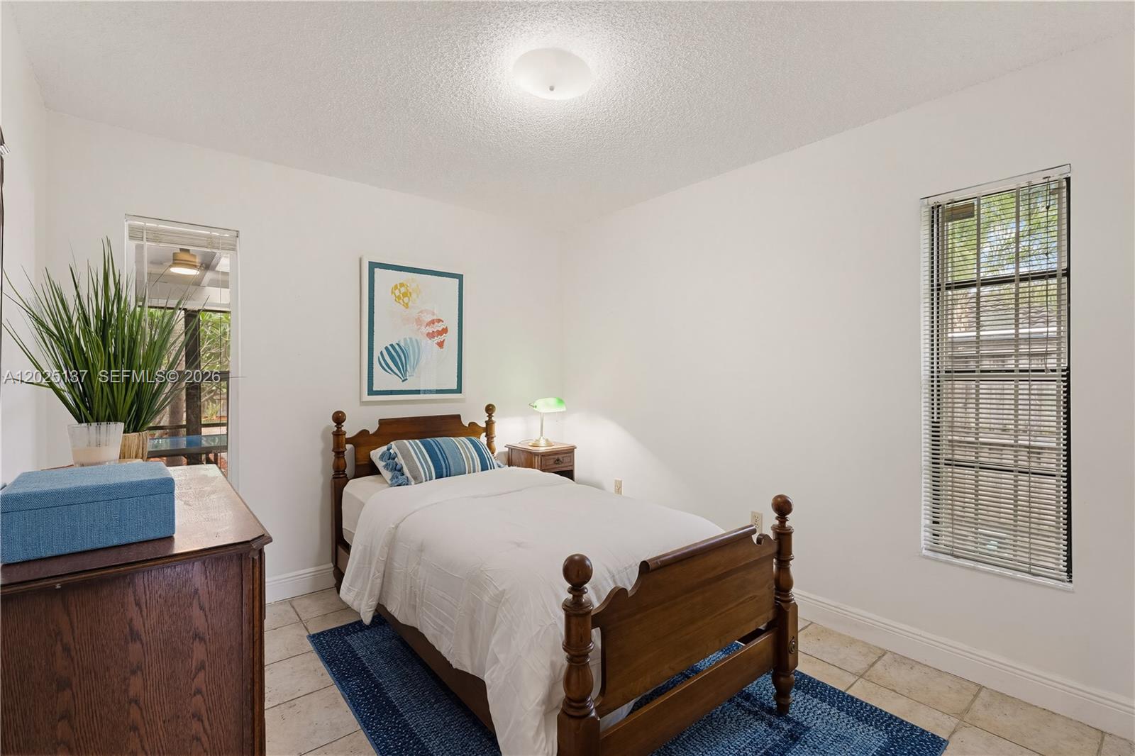 11480 Southwest 96th Terrace Miami, FL 33176 - Photo 20 of 54 a bed room with two bed and a potted plant