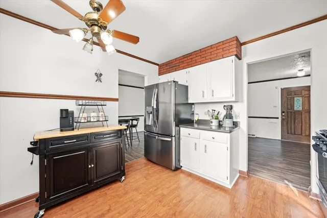 a kitchen with stainless steel appliances granite countertop a stove a refrigerator and a sink