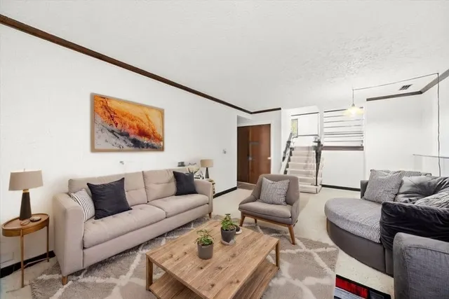 a living room with furniture and a couch