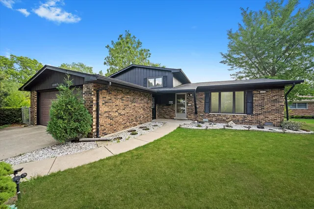 an aerial view of a house with a garden