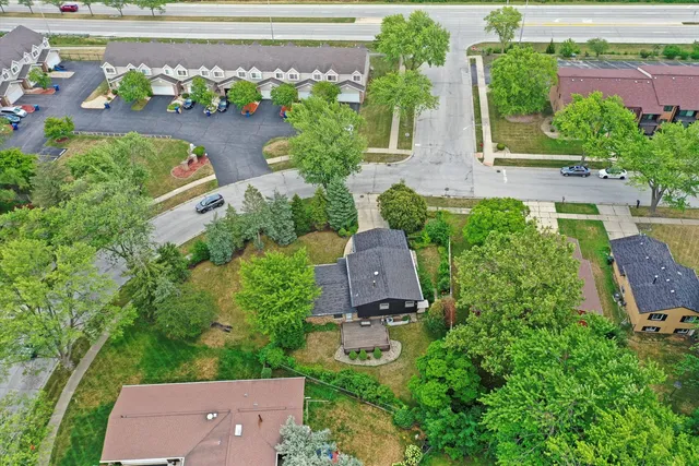 an aerial view of house with yard