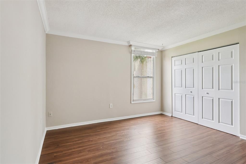 534 Orange Drive, Unit 27 Altamonte Springs, FL 32701 - Photo 15 of 24 an empty room with wooden floor and windows