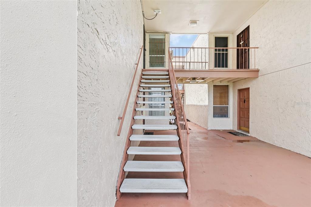 534 Orange Drive, Unit 27 Altamonte Springs, FL 32701 - Photo 23 of 24 a view of entryway and hall with wooden floor