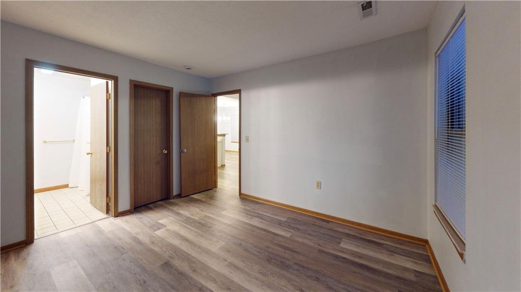 502 Brookstone Court Butler, PA 16001 - Photo 11 of 14 a view of an empty room with wooden floor