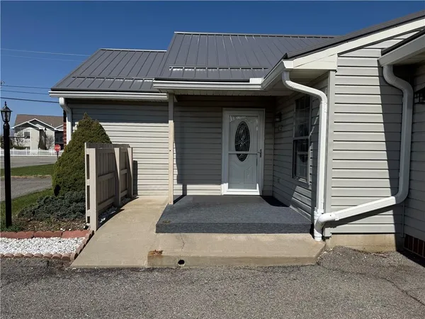 a front view of a house with garage