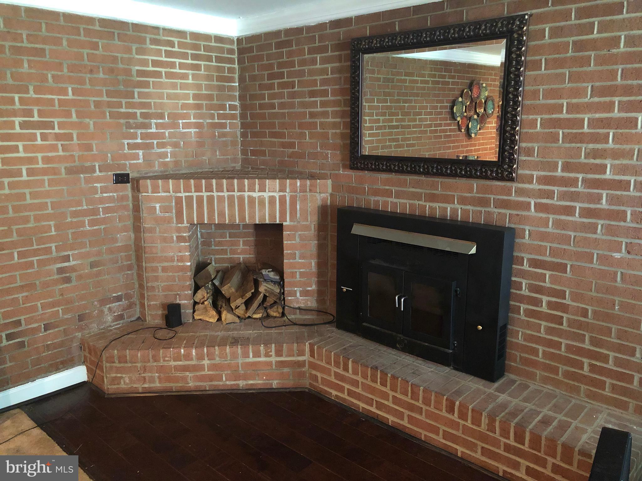 7457 Robin Road La Plata, MD 20646 - Photo 39 of 45 Family room fireplace