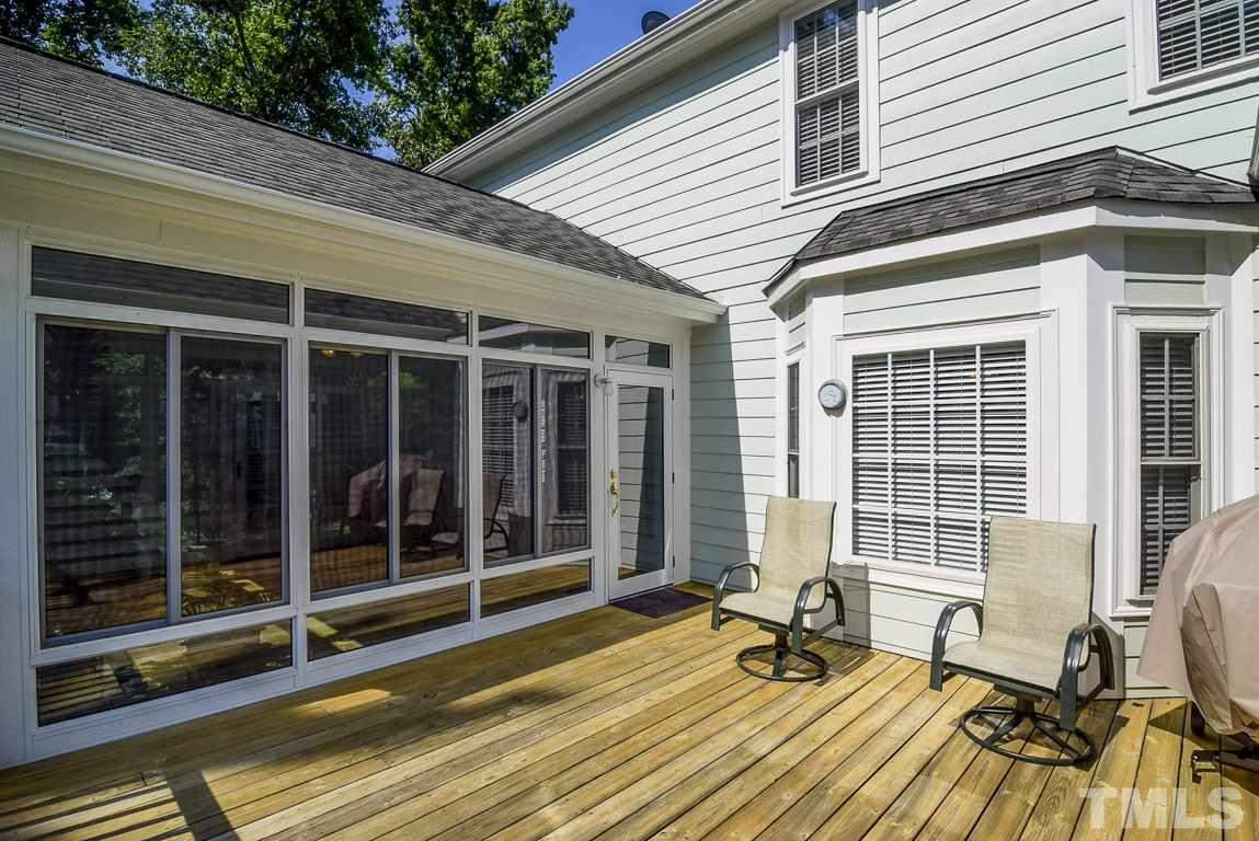 10933 Jordan Road Raleigh, NC 27603 - Photo 22 of 25 a house with wooden floor and outdoor space
