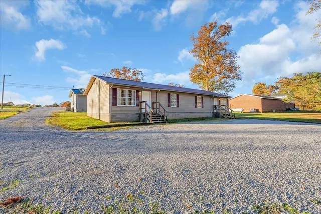 a view of a house with a yard