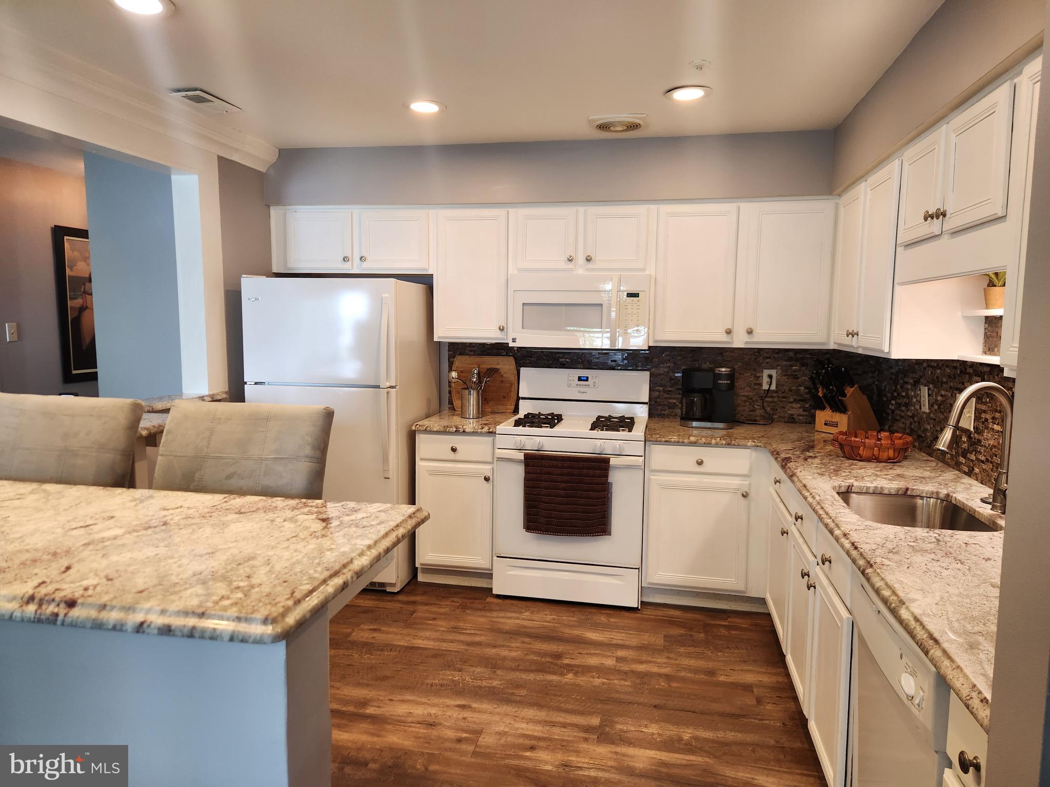 5201 Riverfront Drive Palmyra, NJ 08065 - Photo 4 of 13 a kitchen with a stove a sink and a refrigerator