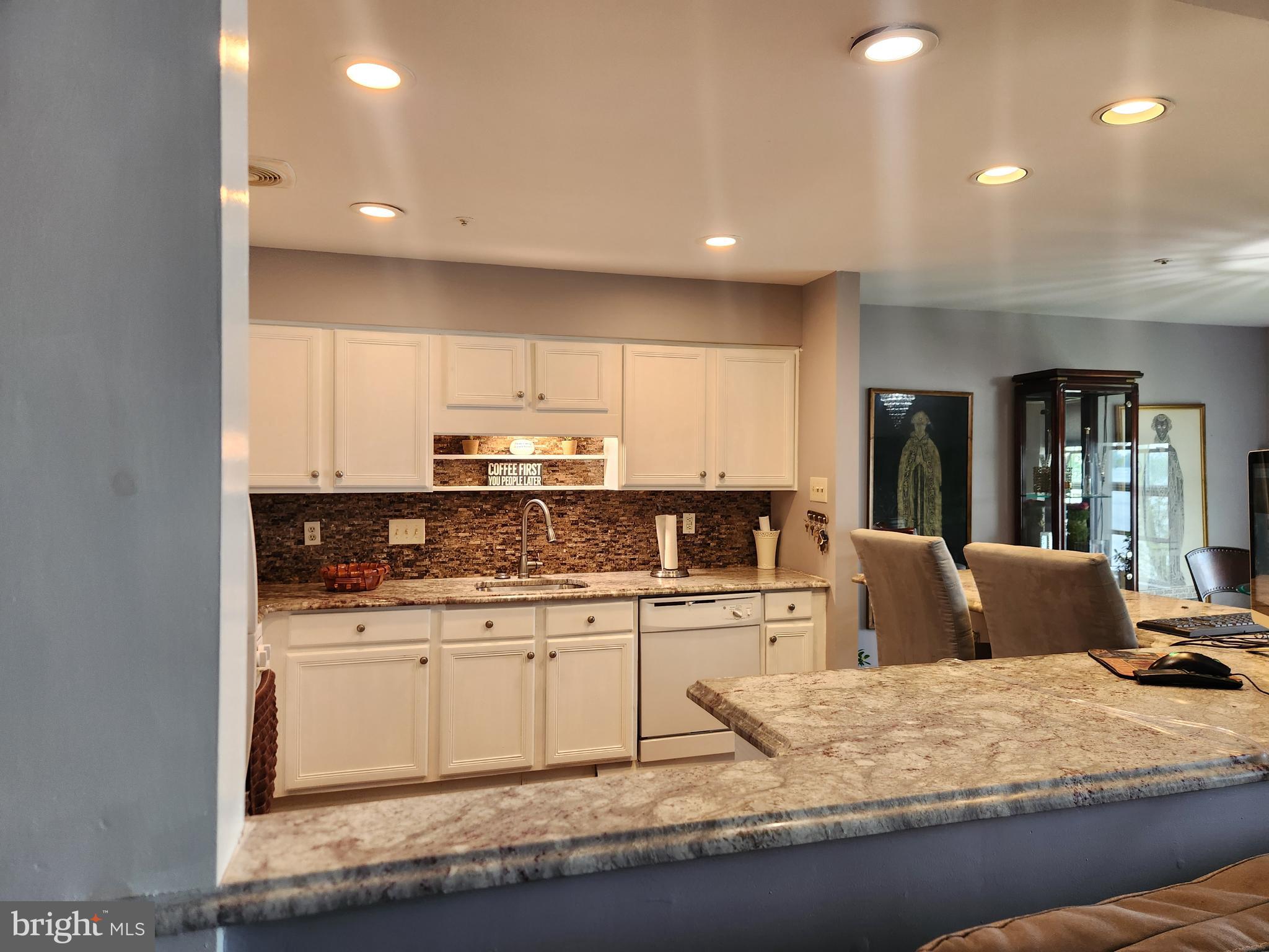 5201 Riverfront Drive Palmyra, NJ 08065 - Photo 5 of 13 a kitchen with stainless steel appliances granite countertop a sink stove and refrigerator