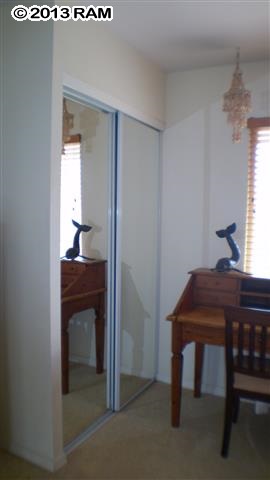 3833 Lower Honoapiilani Road, Unit A203 Lahaina, HI 96761 - Photo 13 of 26 a room that has a table and chair