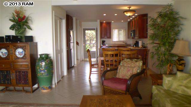 3833 Lower Honoapiilani Road, Unit A203 Lahaina, HI 96761 - Photo 14 of 26 a living room with furniture and a fireplace