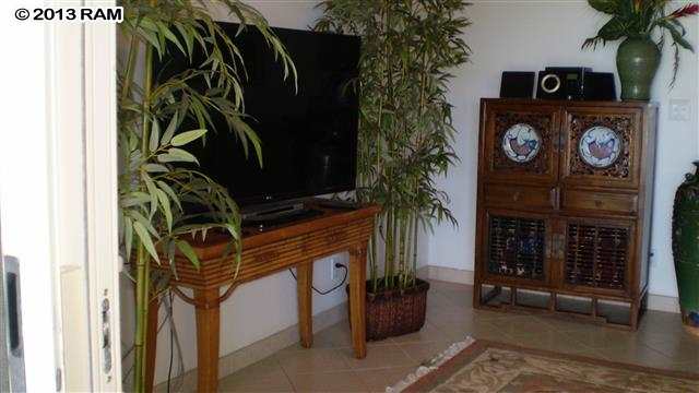 3833 Lower Honoapiilani Road, Unit A203 Lahaina, HI 96761 - Photo 15 of 26 a view of walk in closet with clothes and shoes