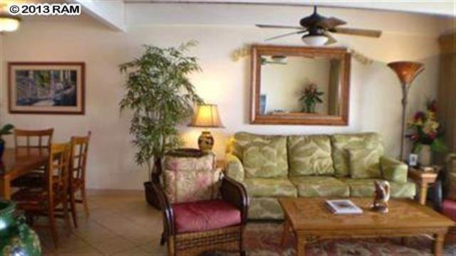 3833 Lower Honoapiilani Road, Unit A203 Lahaina, HI 96761 - Photo 2 of 26 a living room with furniture and a potted plant