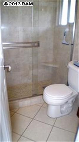 3833 Lower Honoapiilani Road, Unit A203 Lahaina, HI 96761 - Photo 23 of 26 a bathroom with a toilet and a shower