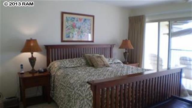 3833 Lower Honoapiilani Road, Unit A203 Lahaina, HI 96761 - Photo 6 of 26 a bedroom with bed and a window