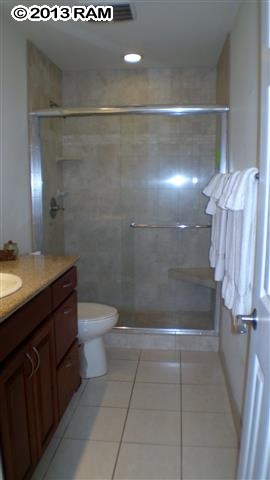 3833 Lower Honoapiilani Road, Unit A203 Lahaina, HI 96761 - Photo 10 of 26 a bathroom with a sink a toilet and shower