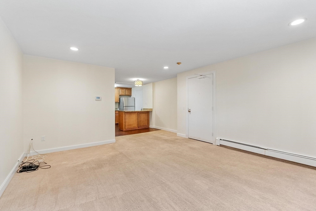 420 Great Road, Unit C1 Acton, MA 01720 - Photo 20 of 29 an empty room with kitchen space and appliances
