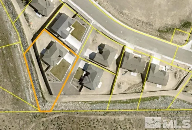 a view of a kitchen counter top space and stove wooden floor