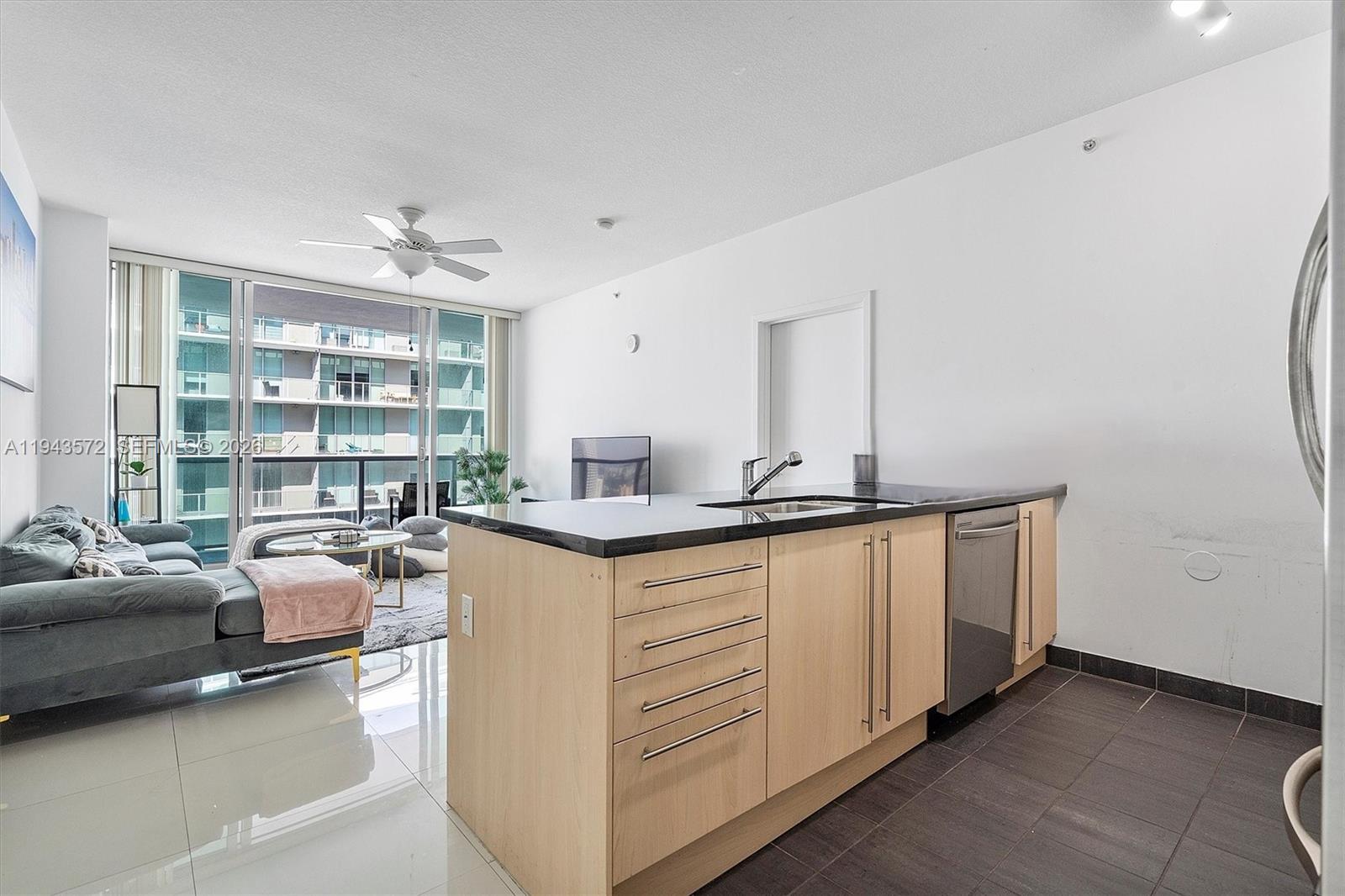 79 Southwest 12th Street, Unit 3809S Miami, FL 33130 - Photo 7 of 21 a kitchen with sink and window