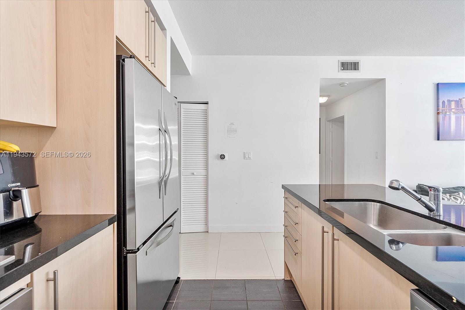 79 Southwest 12th Street, Unit 3809S Miami, FL 33130 - Photo 8 of 21 a bathroom with a sink and a mirror