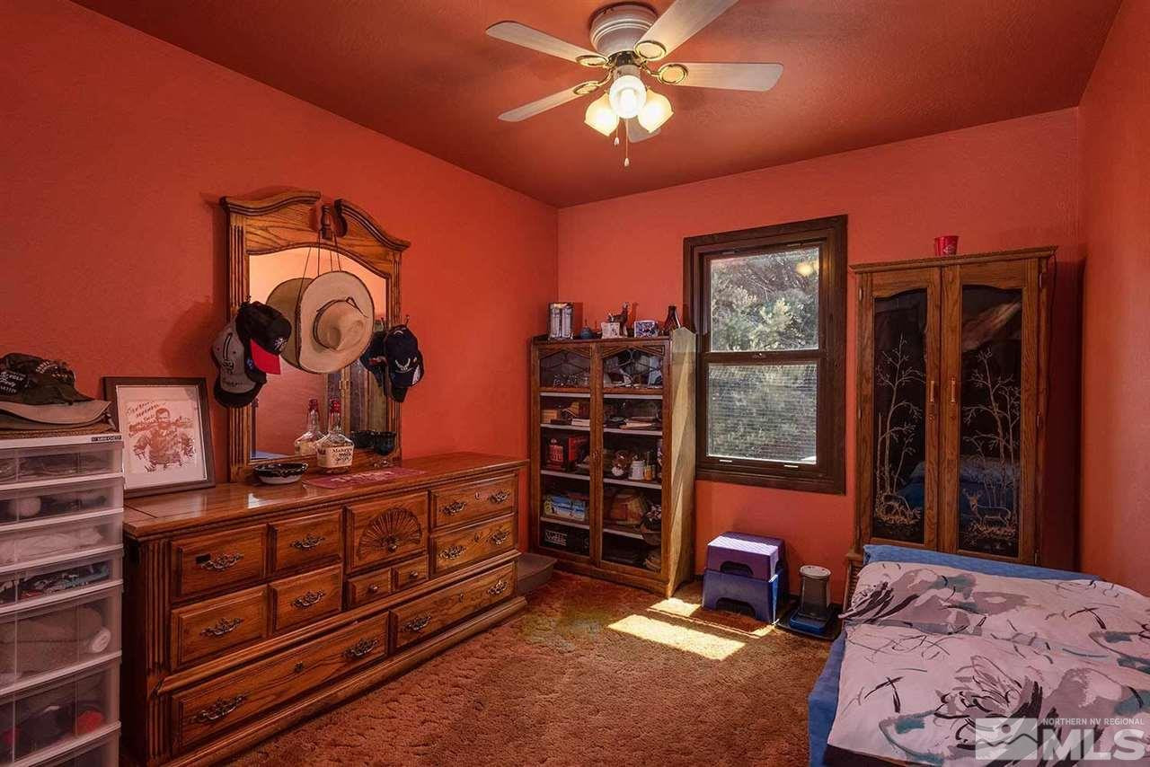 1840 Lousetown Road Reno, NV 89521 - Photo 11 of 25 a bedroom with a bed and furniture