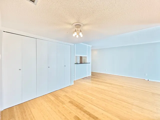 a view of empty room with ceiling fan