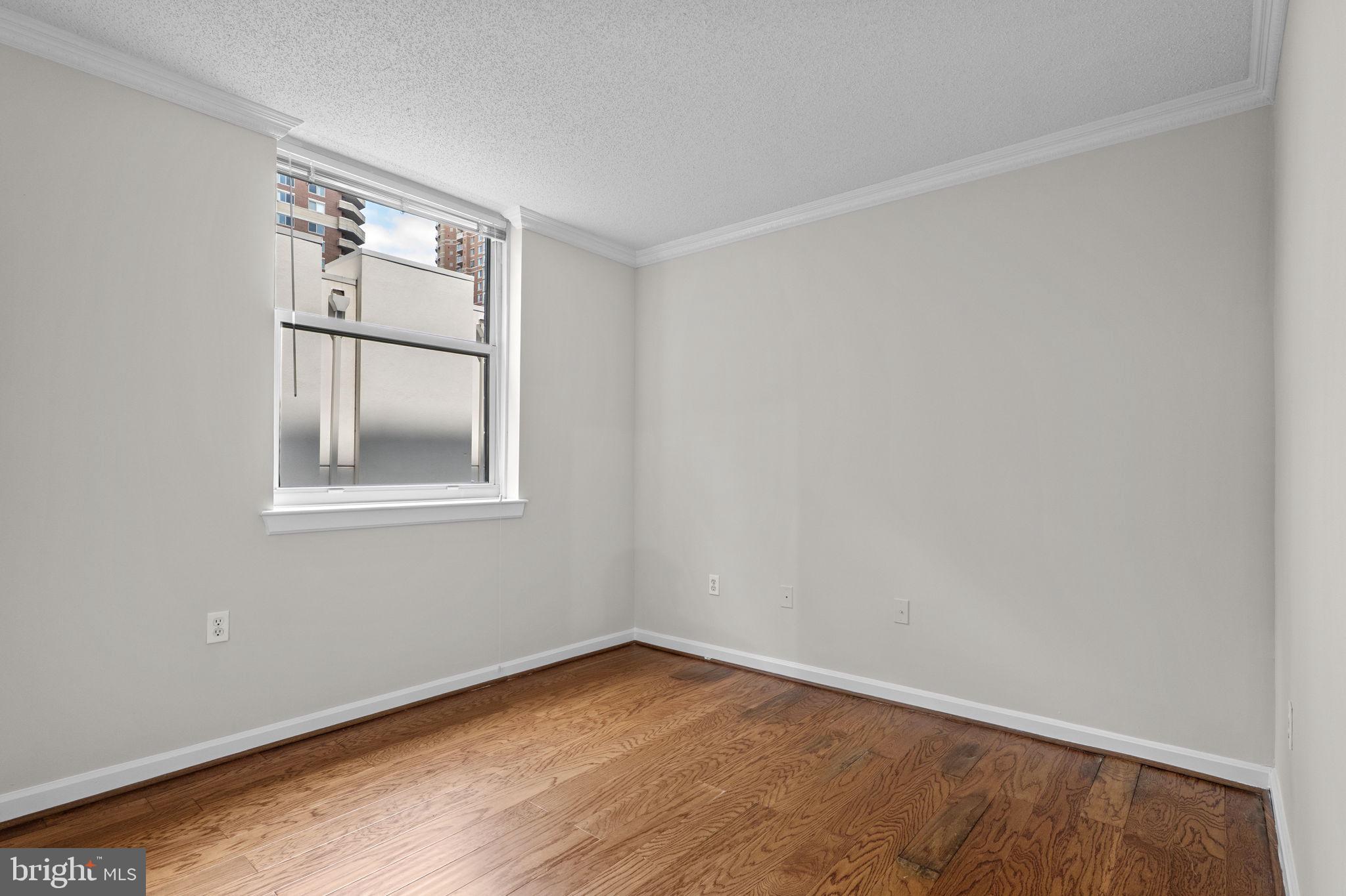 880 North Pollard Street, Unit 224 Arlington, VA 22203 - Photo 17 of 39 an empty room with a window