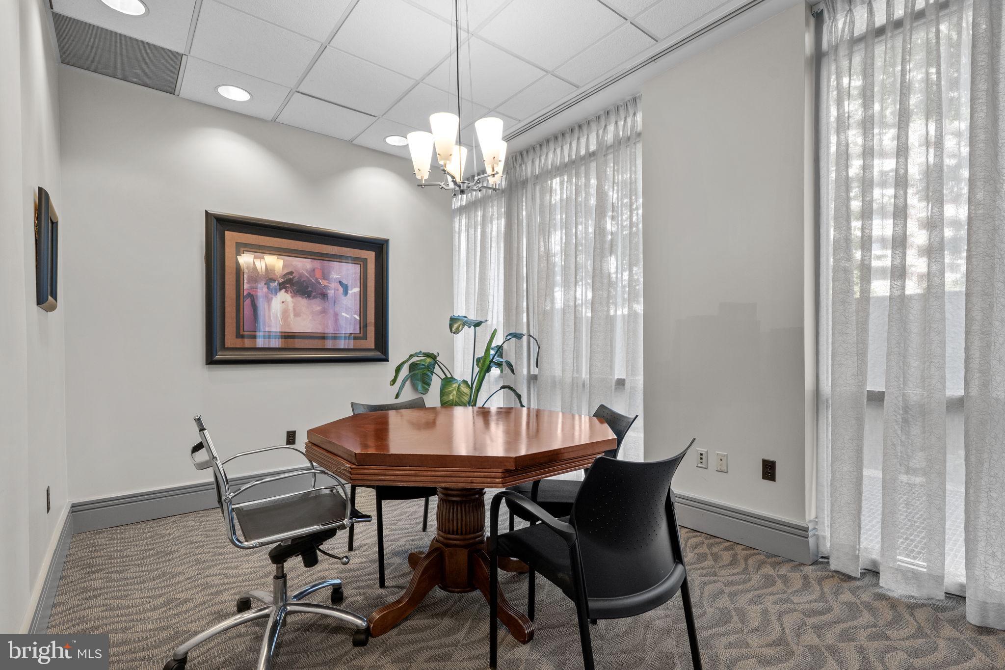 880 North Pollard Street, Unit 224 Arlington, VA 22203 - Photo 32 of 39 a view of a dining room with furniture window and wooden floor
