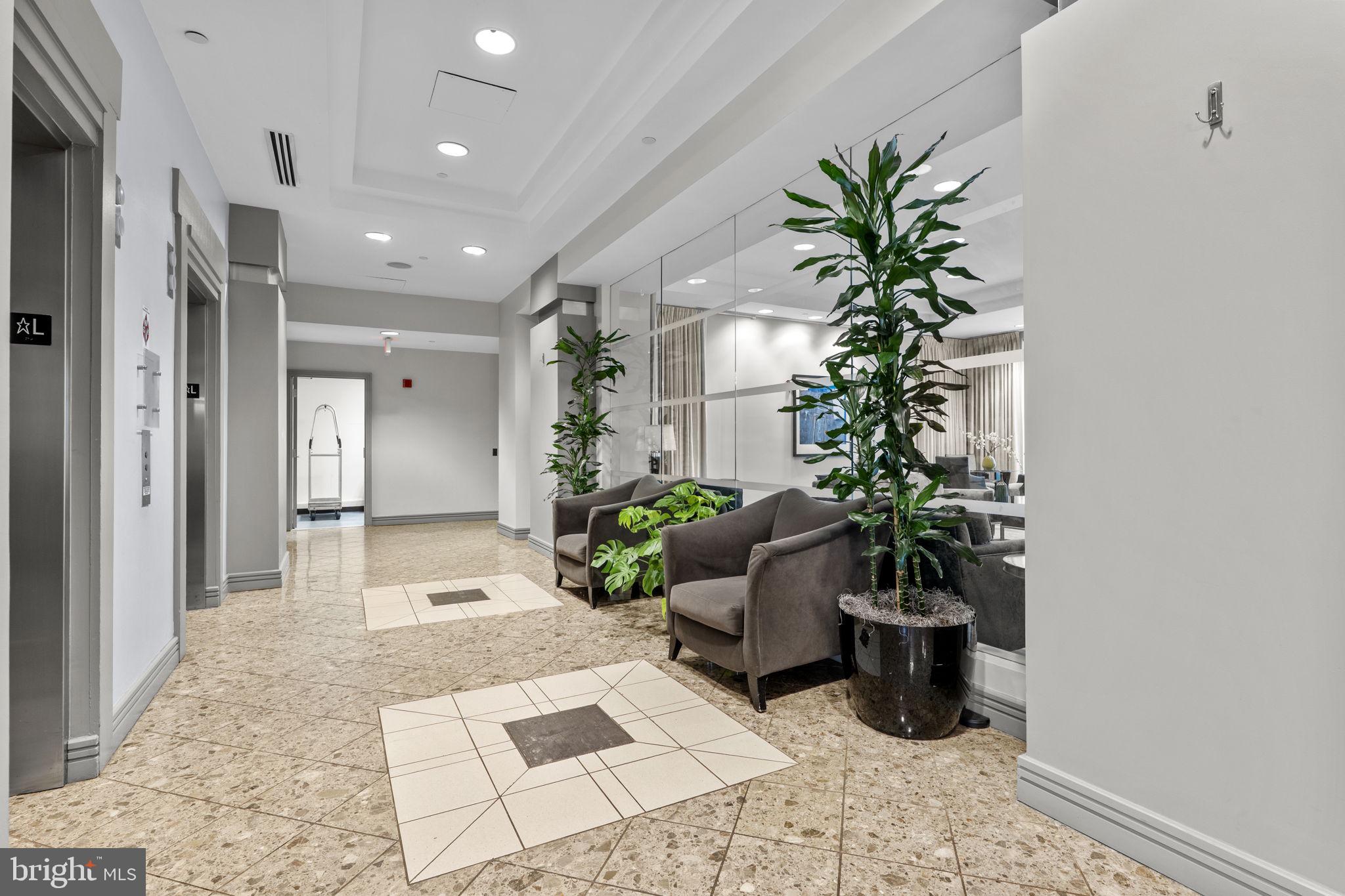 880 North Pollard Street, Unit 224 Arlington, VA 22203 - Photo 37 of 39 a view of a hallway with a potted plant