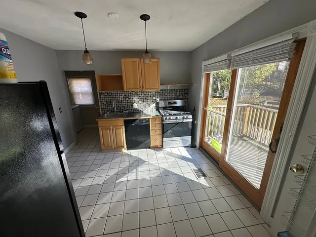 a view of a room with window furniture and floor to ceiling window