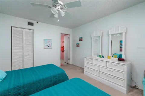 a bedroom with a bed and a dresser