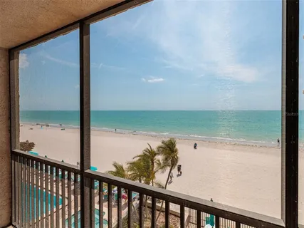 a view of a balcony with an ocean view