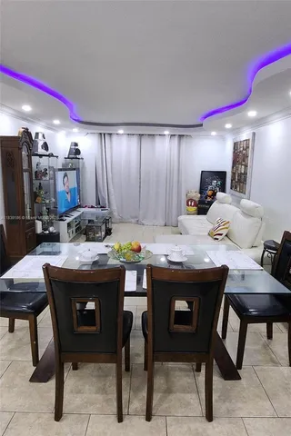 a kitchen with stainless steel appliances granite countertop white cabinets and a stove a sink