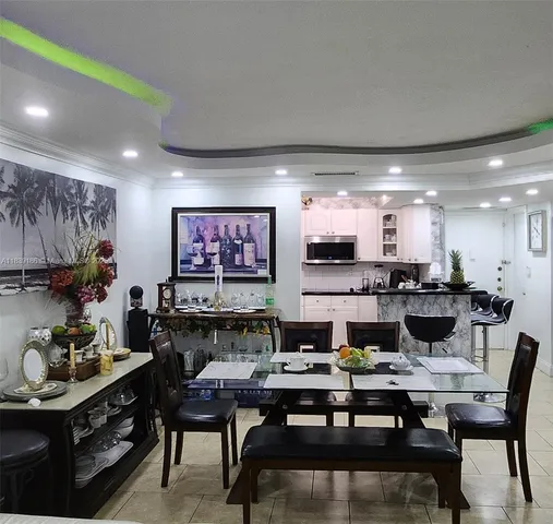 a kitchen with stainless steel appliances granite countertop white cabinets and sink