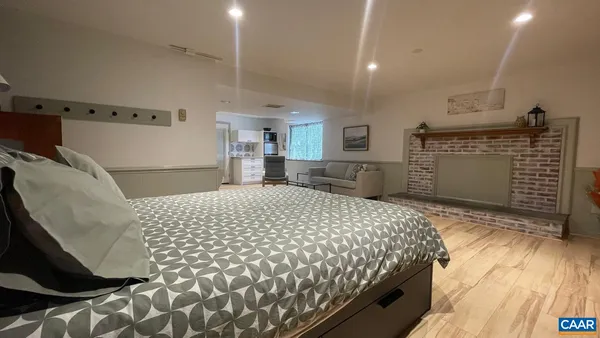 a bedroom with a bed and a dresser