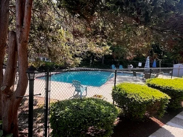a view of a swimming pool with a patio
