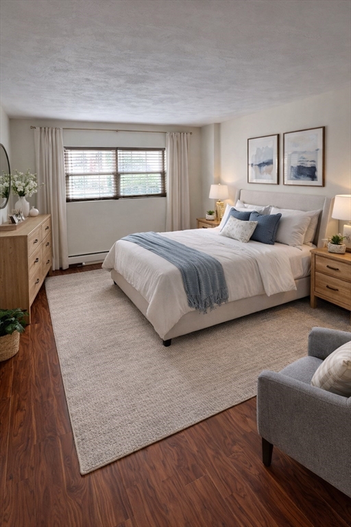 15 Cass Street, Unit 3 Boston, MA 02132 - Photo 7 of 24 a spacious bedroom with a bed and window