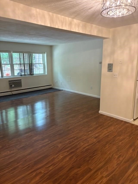 15 Cass Street, Unit 3 Boston, MA 02132 - Photo 8 of 24 a view of room with window and wooden floor