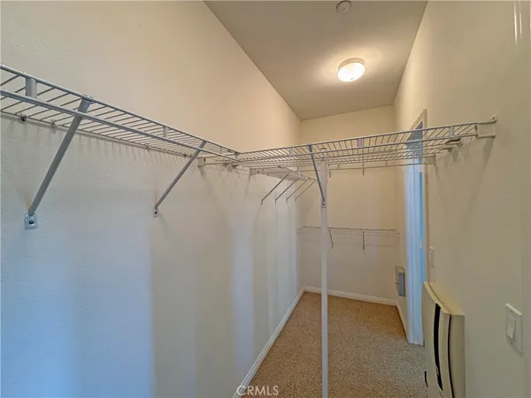 a view of a room with racks on the wall