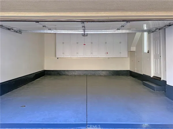 a front view of a house with a yard and plants