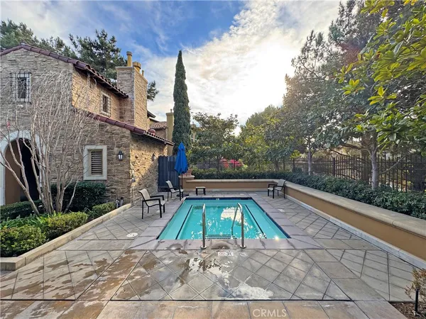 a view of a swimming pool with a backyard