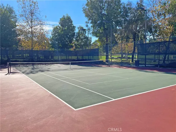 a view of a swimming pool with a yard