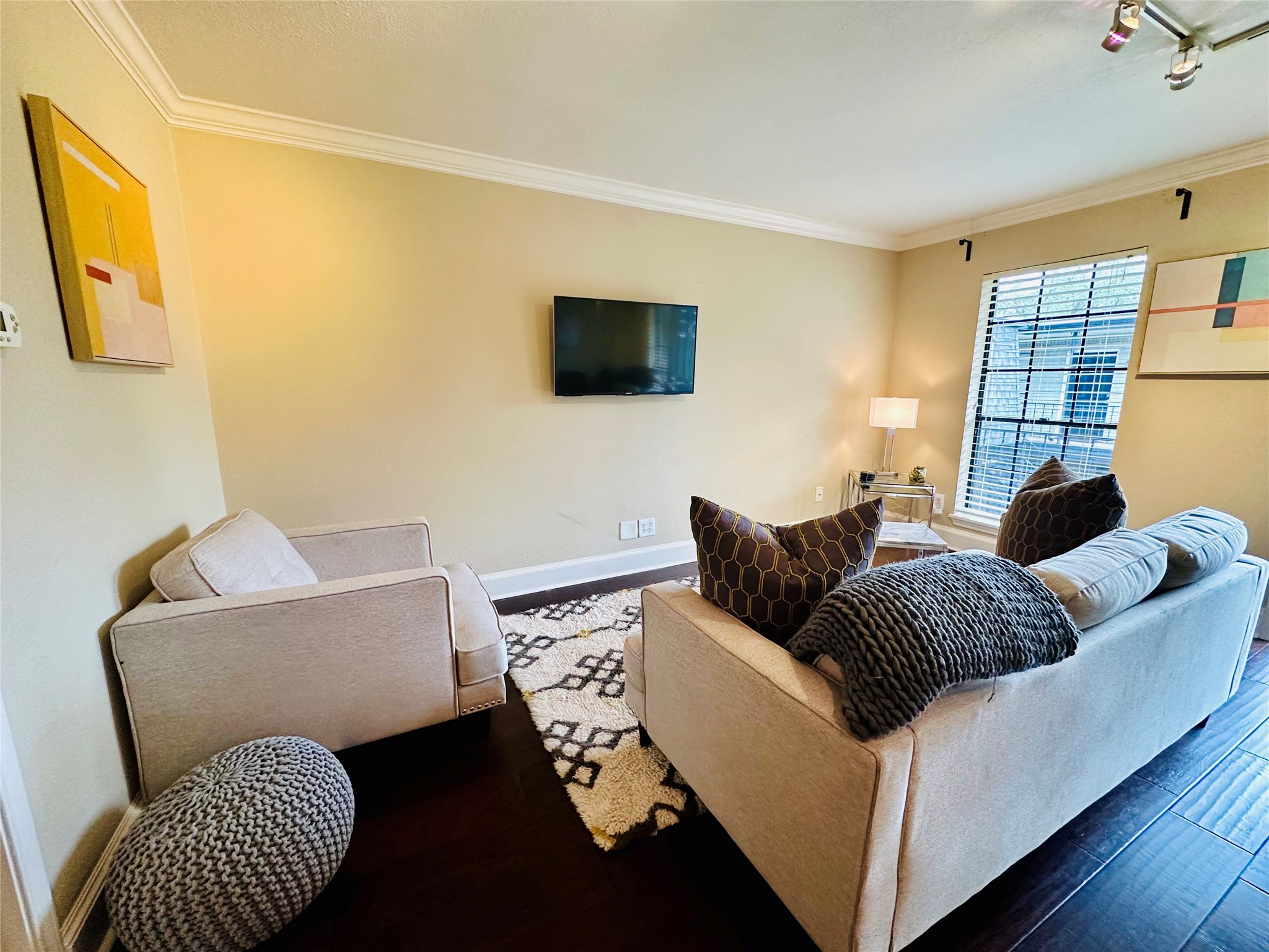 3402 Garrott Street, Unit 16 Houston, TX 77006 - Photo 11 of 47 a living room with furniture and a window
