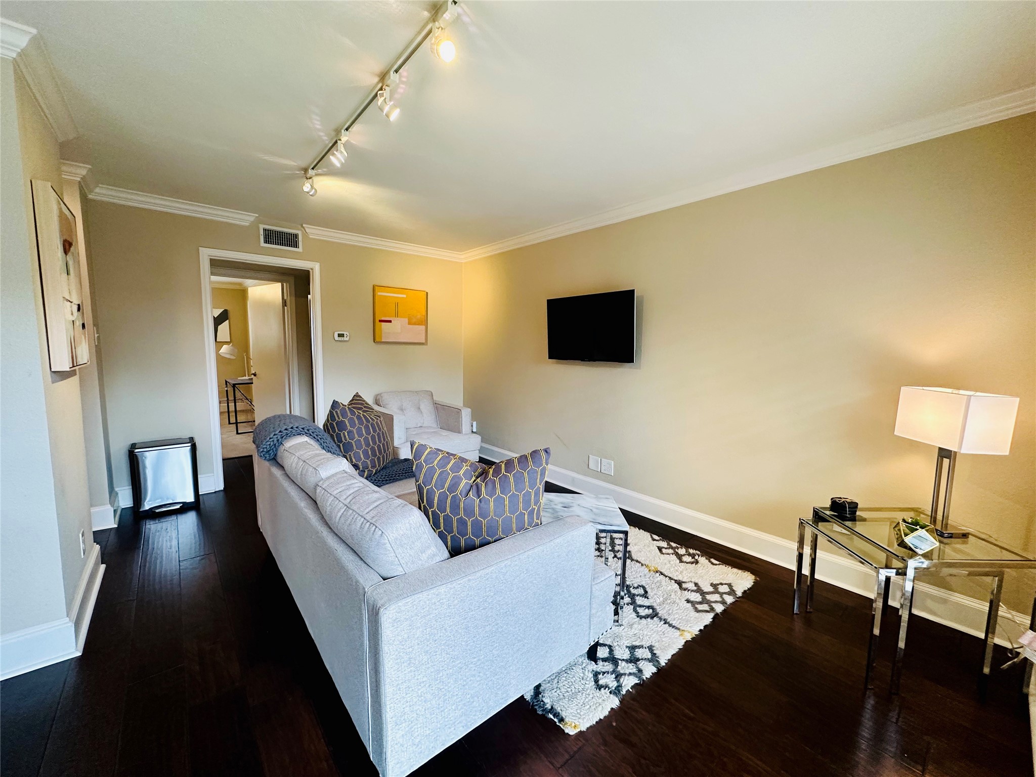 3402 Garrott Street, Unit 16 Houston, TX 77006 - Photo 12 of 47 a living room with furniture and a flat screen tv