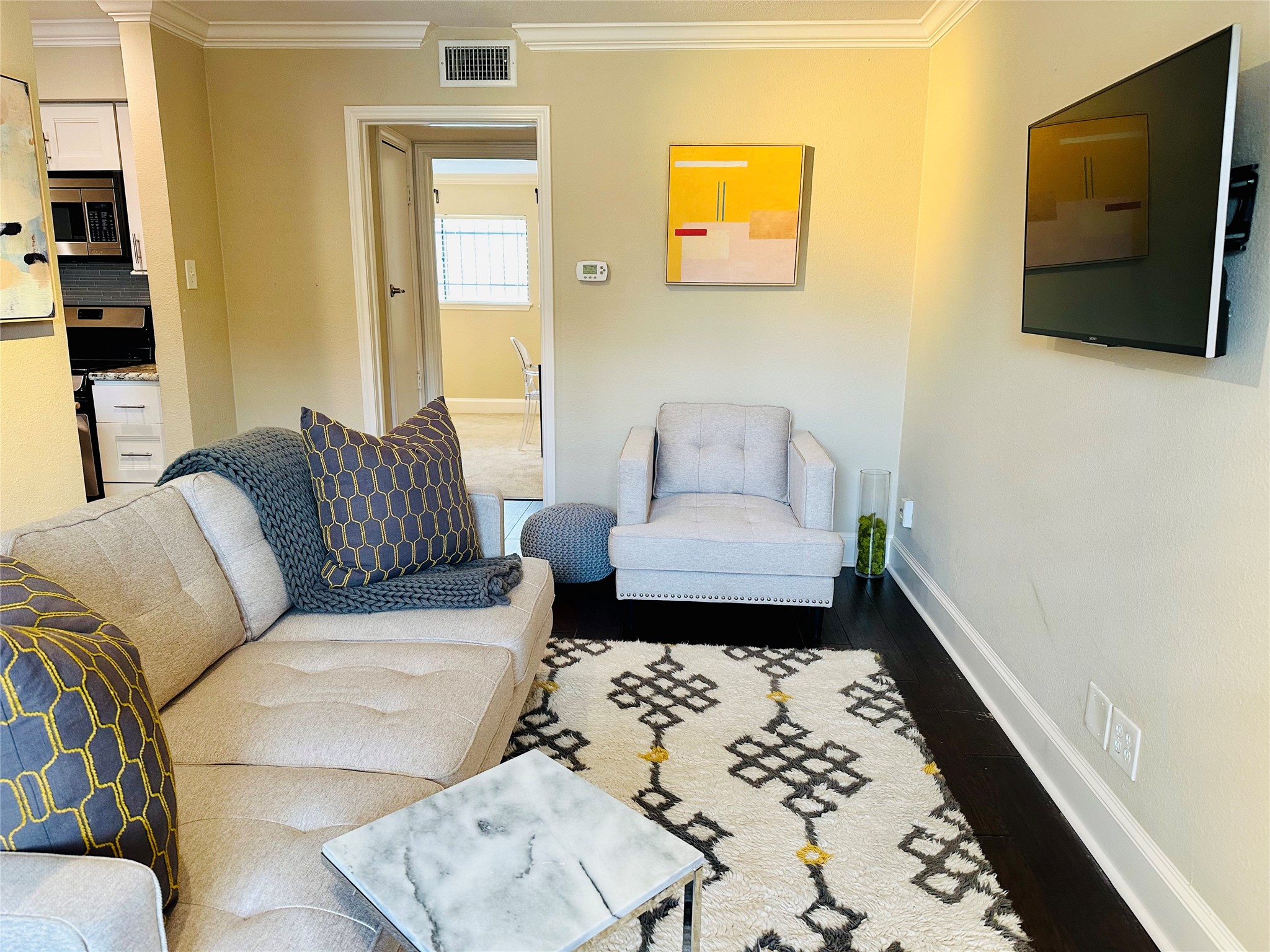 3402 Garrott Street, Unit 16 Houston, TX 77006 - Photo 14 of 47 a living room with furniture and a flat screen tv