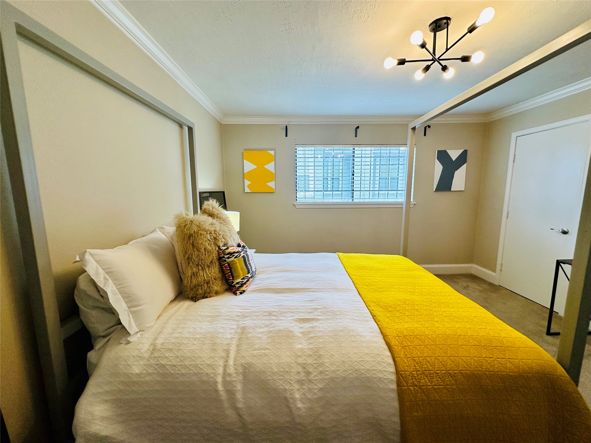 3402 Garrott Street, Unit 16 Houston, TX 77006 - Photo 16 of 47 a bedroom with a bed and a window